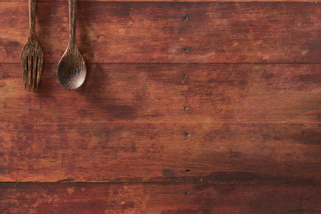 vintage look wooden Spoon and fork on wooden table background.の写真素材