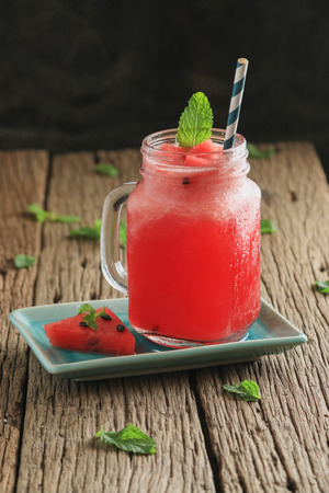 watermelon smoothie on old wooden tableの写真素材