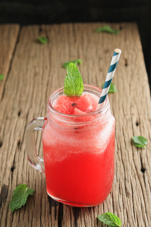 watermelon smoothie on old wooden tableの写真素材