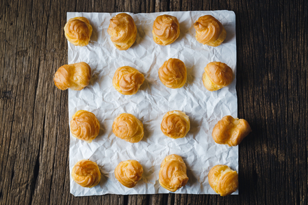 Cream Puffs on wooden .の写真素材