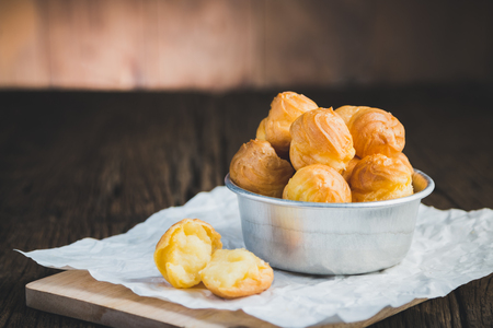 Cream Puffs on wooden .の写真素材
