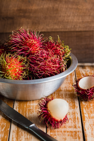 Fresh rambutan on wooden table backgroundの写真素材