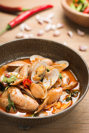 Delicious Thai Food stir fried clams with roasted chili paste on woodenの写真素材