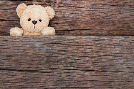 Cute teddy bears on old wood background with copy spaceの写真素材