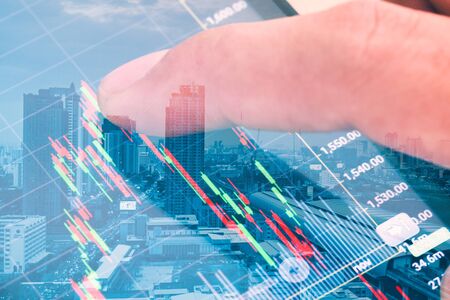 double exposure, macro close up a man checking stock market on tablet, smartphone