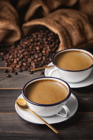 Vintage Coffee cup and coffee beans with bag. dark food styleの写真素材