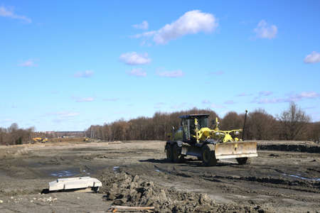 The road is in the final stages of construction in early spring.