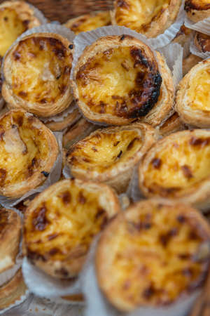 A tray of Portuguese custard tarts on displayの写真素材