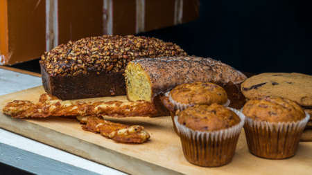Breadsticks, cakes, muffins, and cookies on display