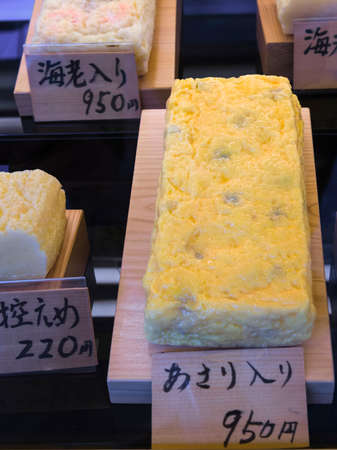 Different kinds of Japanese omlette for sale on a stallの写真素材