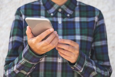 Woman hand holding and using smart phone