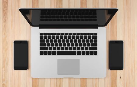 Computer laptop and smart phone blank screen on wood table background workspace mock up design...