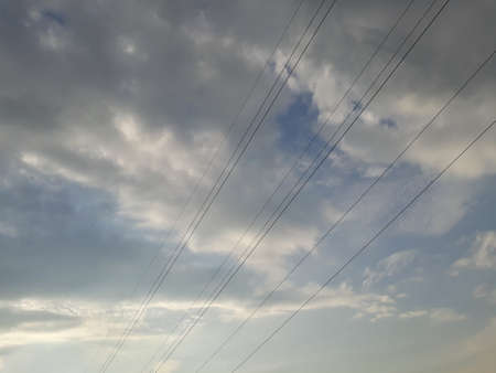 Electric wires on a background of cloudsの写真素材