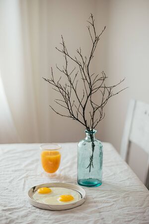 Fried egg on a white table. orange juice