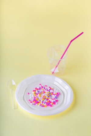 Social content. Plastic food in disposable dishes on a yellow background. Copy space.の写真素材