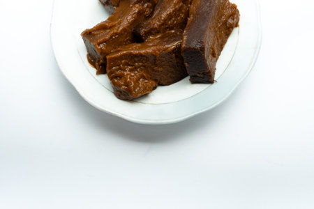 Dodol on a serving plate. This traditional sweet snack originating from Indonesia made from...