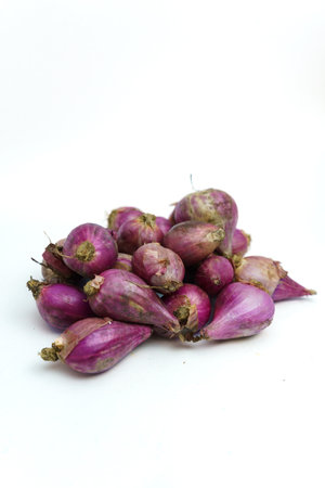 purple shallot isolated on white background, closeup of photoの写真素材