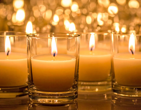 Warmly lit candles create a peaceful and inviting atmosphere perfect for relaxation and ambiance Use as a background for meditation or wellness themesの素材