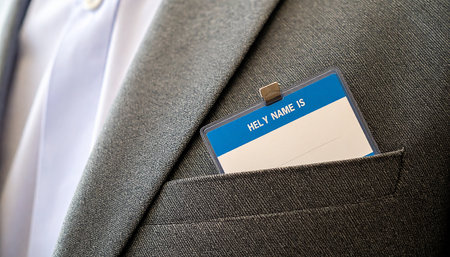 Businessman in suit with a business card in his pocket. Business concept.の素材