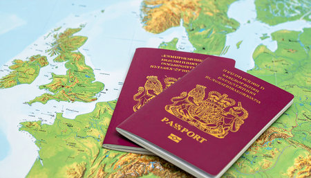 Two passports on the background of the world map. Travel concept.の素材