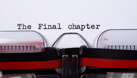 The sentence is written with an old typewriter on white paper.の素材