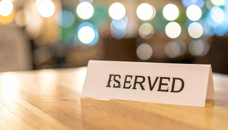 Restaurant reserved sign on wood table with bokeh backgroundの素材