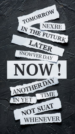 Torn paper strips with words like "NOW", "Tomorrow", "Later", "Never" on dark textured backgroundの素材