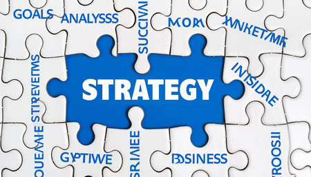 Jigsaw puzzle with STRATEGY in the center and surrounding business-related words Clear details and vibrant co...の素材