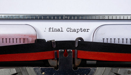 Typewriter with black and red ribbon on white paper with the text Final Careerの素材