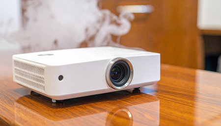 White projector on the wooden table in the conference room. Video projectorの素材