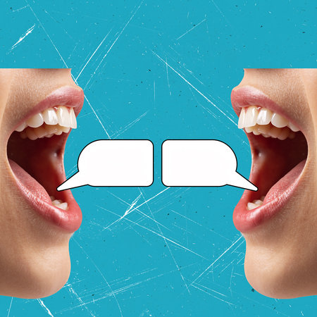 Two open mouths with blank speech bubbles between them on a textured blue background.の素材