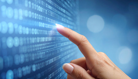 hand pushing a button on a touch screen interface with a binary codeの素材
