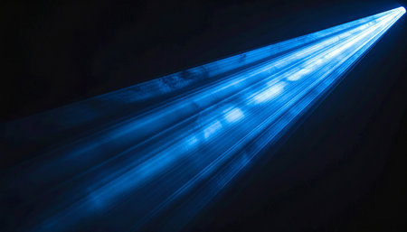 abstract blue light rays on a dark background, close-upの素材