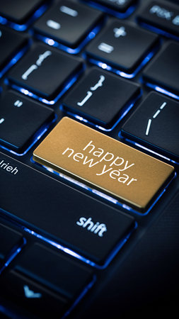 A golden key with "happy new year" illuminated on a dark, blue-lit keyboard. Clear details and vibrant colors...の素材