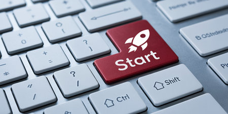A red keyboard key with a rocket icon and the word "Start". Clear details and vibrant colors enhance visual a...の素材
