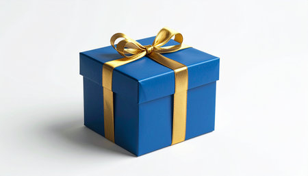 Blue gift box with gold ribbon on white background. Isolated.の素材