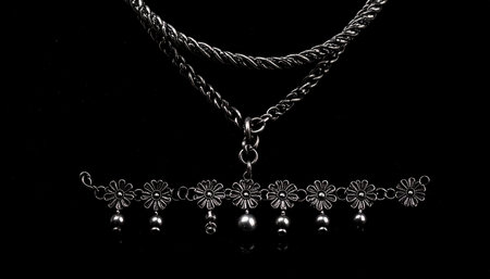 necklace on a black background in close-up, beautiful photo digital pictureの素材