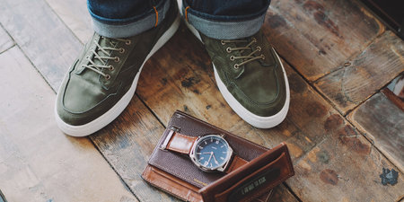 Men's shoes, watch and wallet on the wooden floor background.の素材