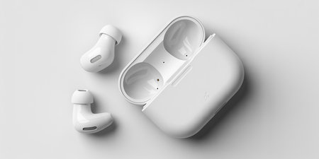 3D rendering of a wireless earphones isolated in white studio backgroundの素材