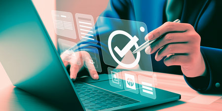 Close up of businessman hand using laptop with check mark icon on screenの素材