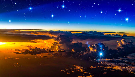 Aerial view of clouds and stars at sunset. View from airplane window.の素材