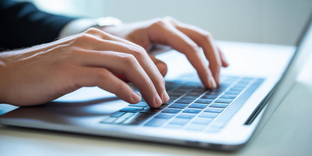 Closeup of businesswoman hands typing on laptop keyboard. Business and technology conceptの素材