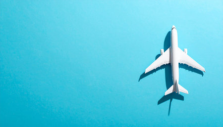 Airplane model on blue background with copy space. Travel concept.の素材
