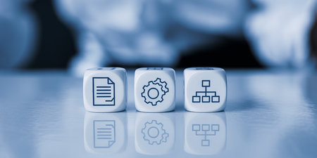 Concept of software development with dice on a desk in blue toneの素材