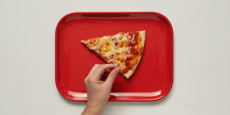 Pizza slice on a red plate, top view, white backgroundの素材