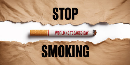 World No Tobacco Day concept with cigarette and torn paper on white backgroundの素材
