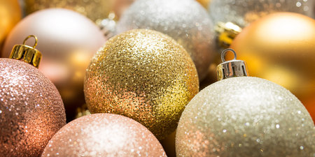 Christmas background with golden and silver ornaments, shallow depth of fieldの素材
