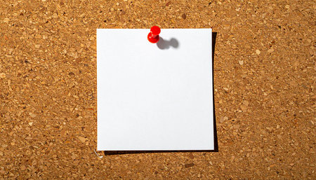 Blank paper with red pin on cork board, business conceptの素材