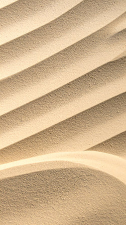Abstract background of sand waves on the beach. Close-up.の素材