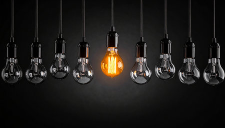 Incandescent light bulb on dark background. 3D rendering.の素材